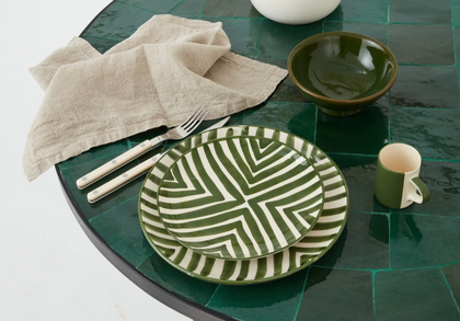 Styled green ceramic tableware setting