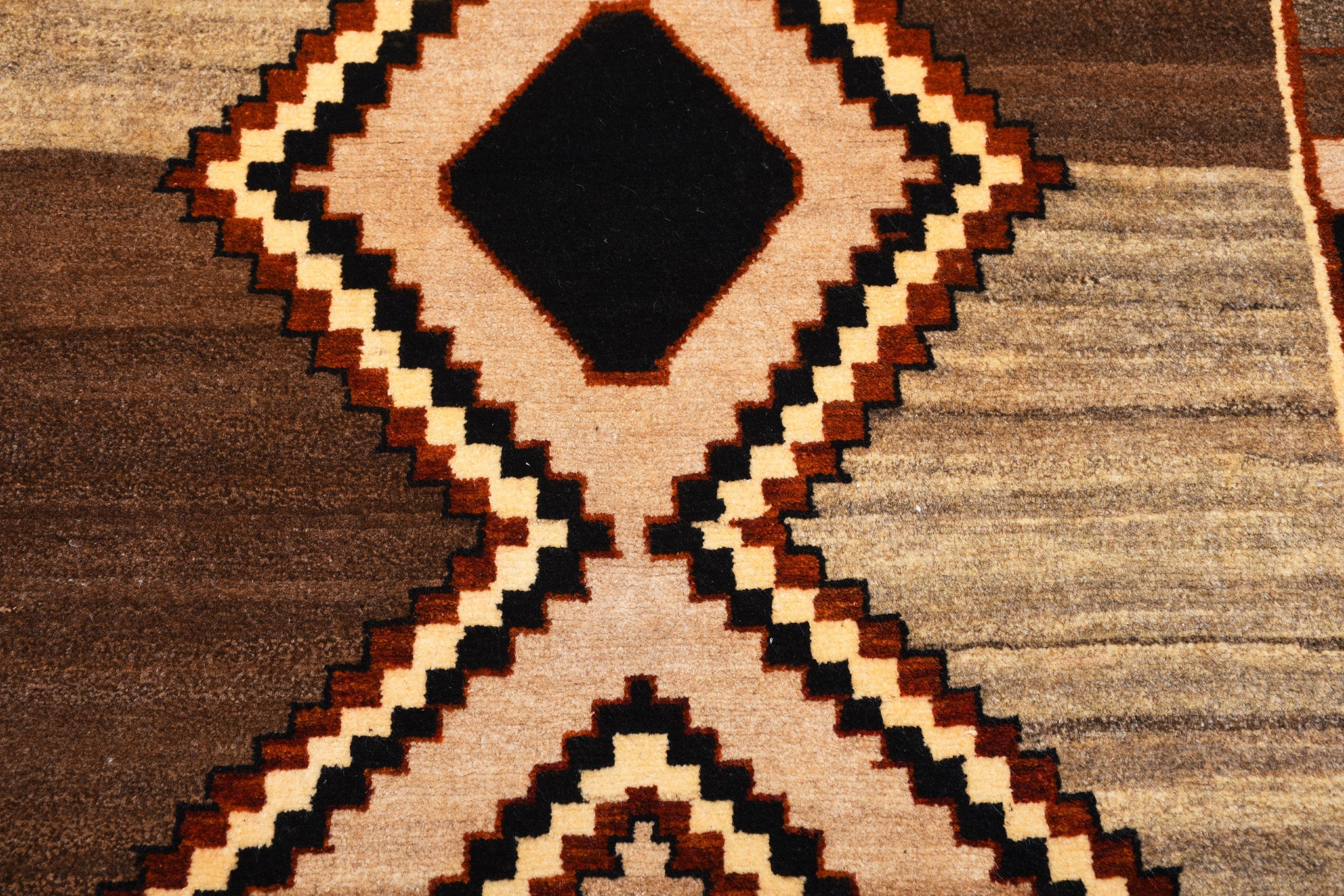 Close-up of antique Persian Gabbeh rug texture and handwoven wool
