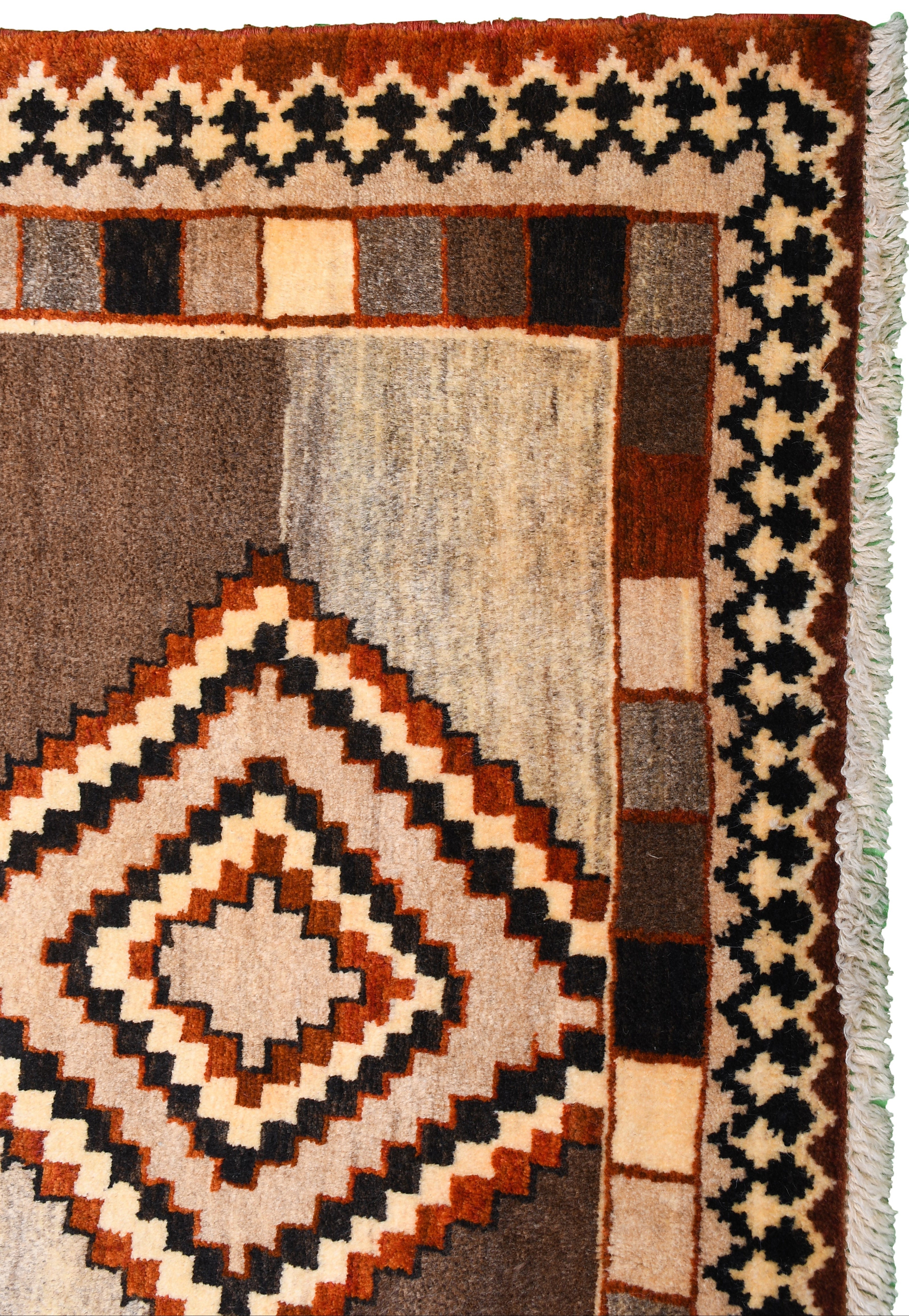 Antique Persian Gabbeh rug detail showing tribal diamond pattern