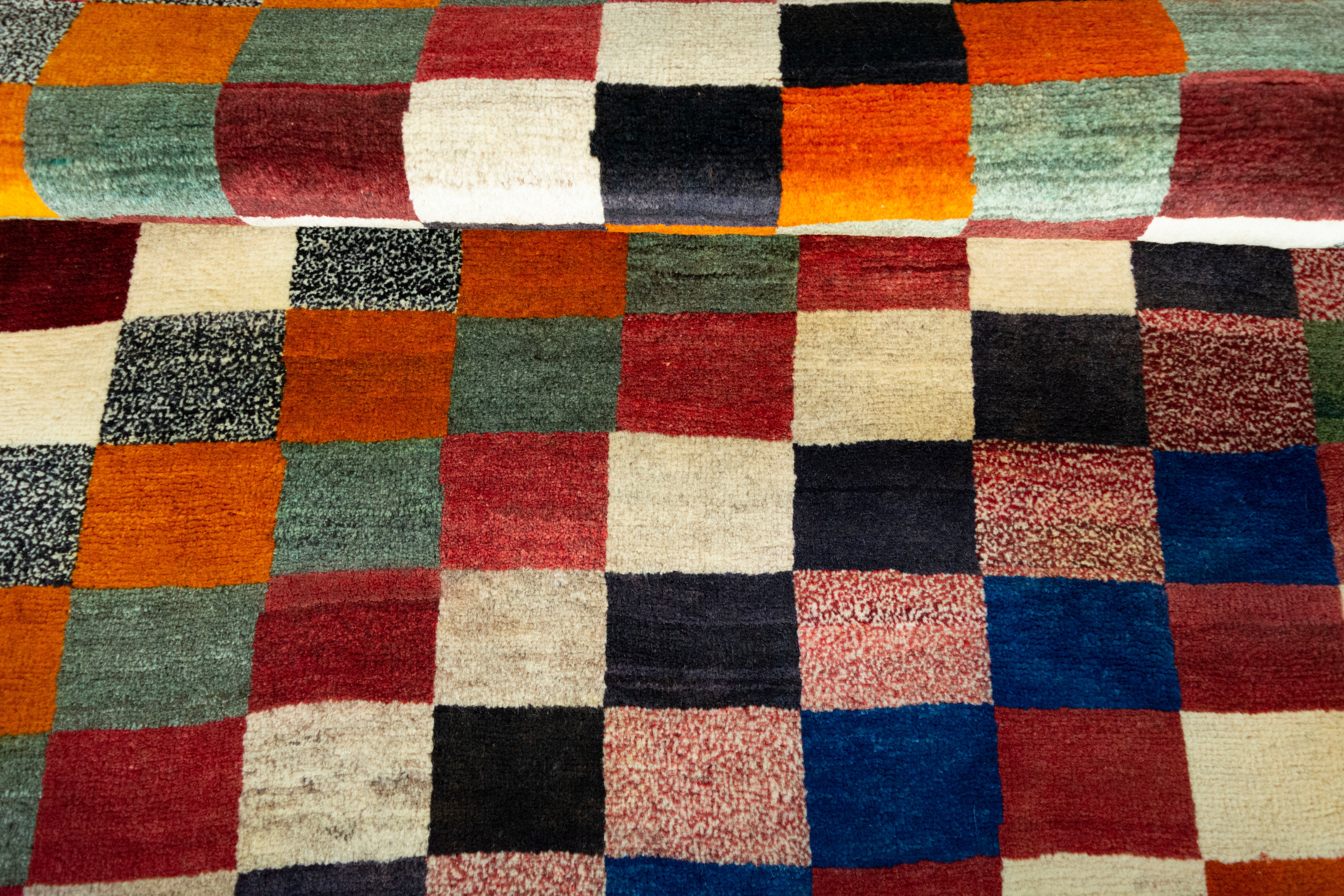 Detail of antique Persian Gabbeh rug with geometric design