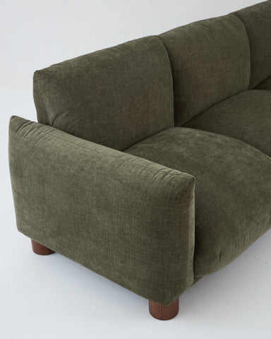 Side profile of Sumi 3-Seater Sofa in Forest finish highlighting inclined backrest