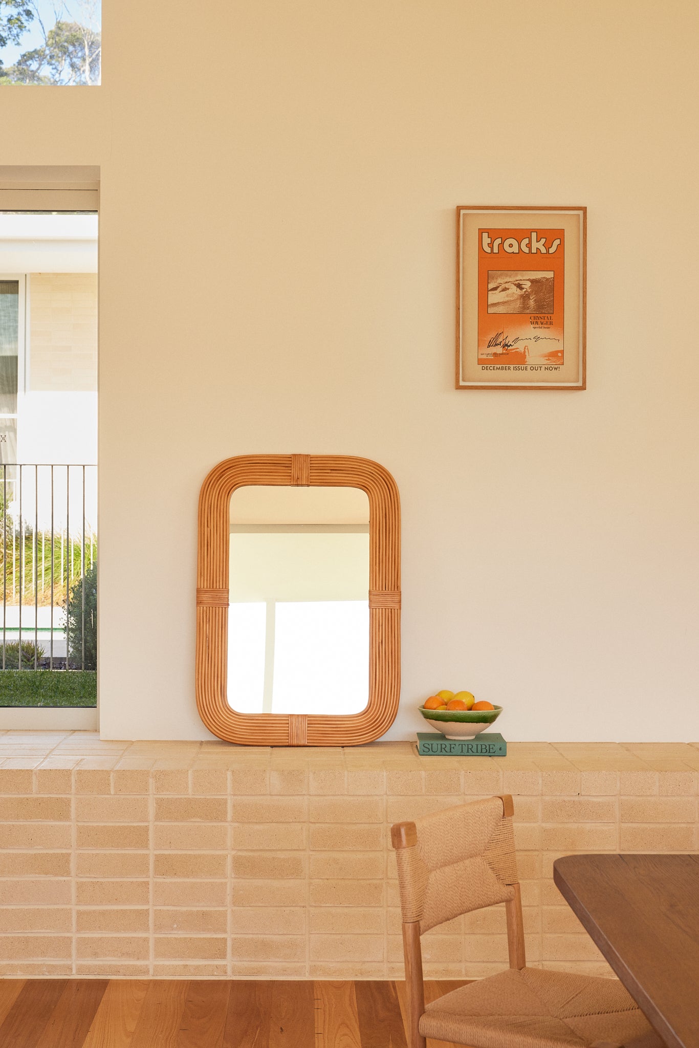 Dune Curved Vanity Rattan Mirror styled in a modern living room