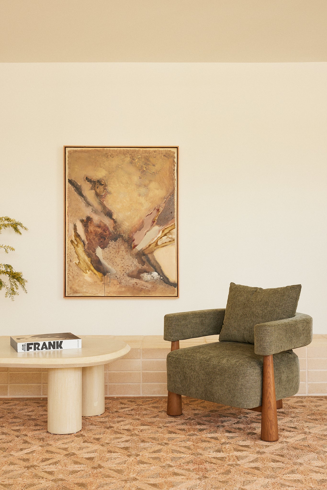 Arlo Armchair in Forest fabric styled with the Bean Micro-Cement Coffee Table and original artwork by Stephen Skinner.