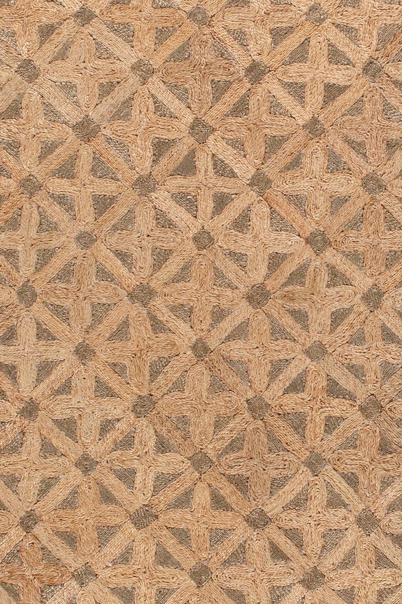 Detail of natural jute rug showing geometric braided pattern