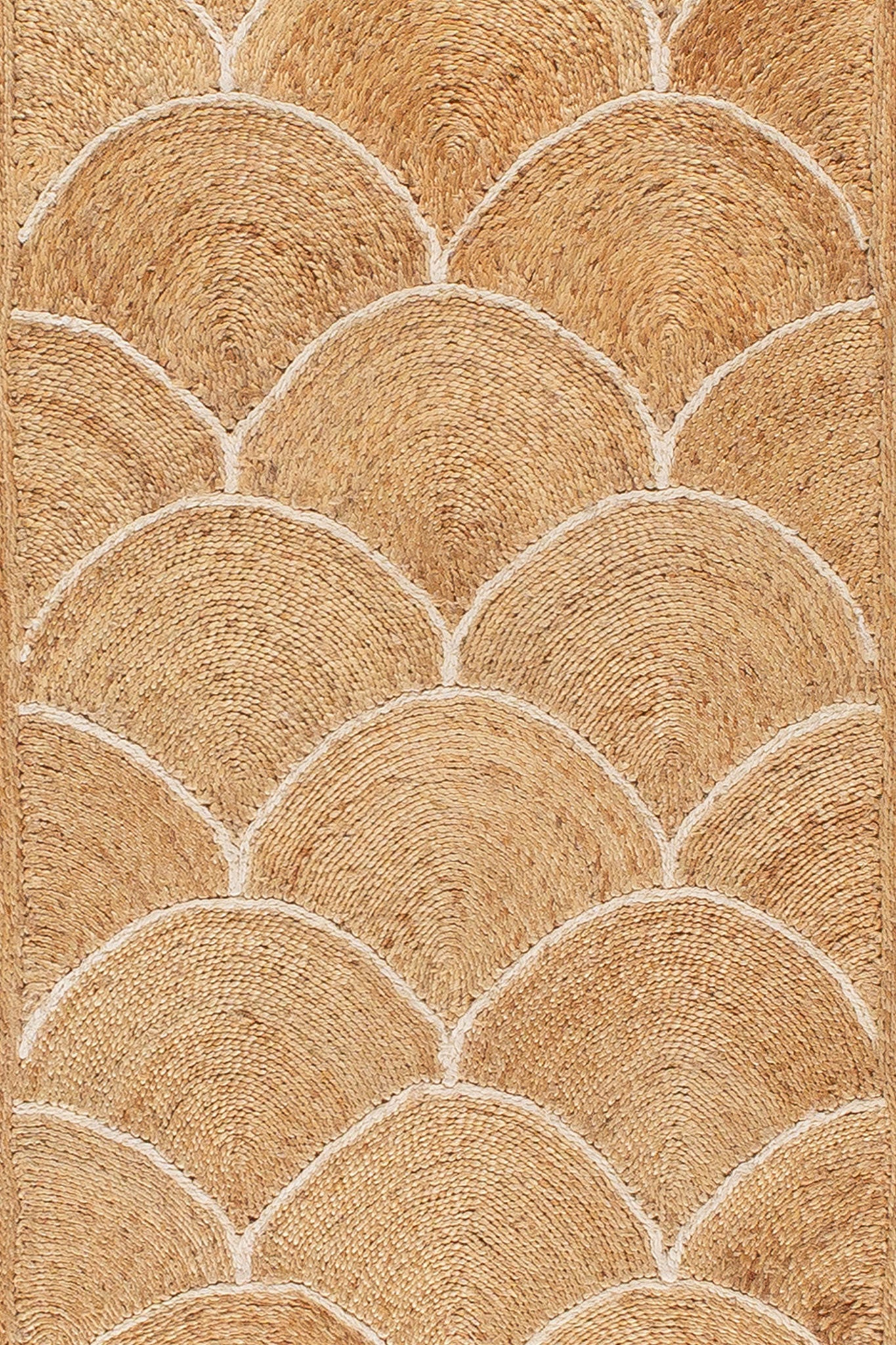 Detail of Scallop White rug showing scallop pattern in handwoven natural fibres