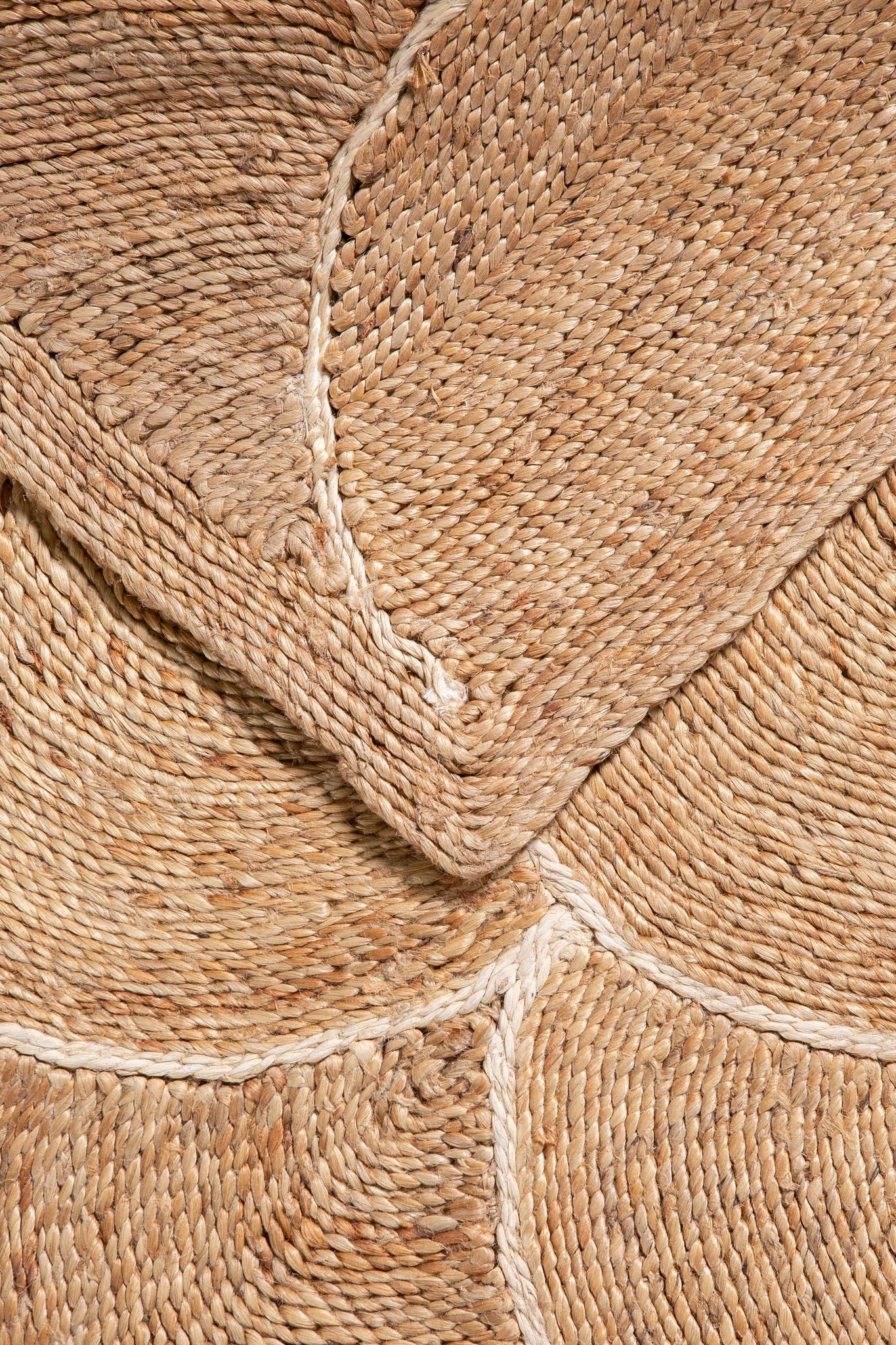 Corner detail of Scallop White runner rug showing handwoven texture and scallop motif