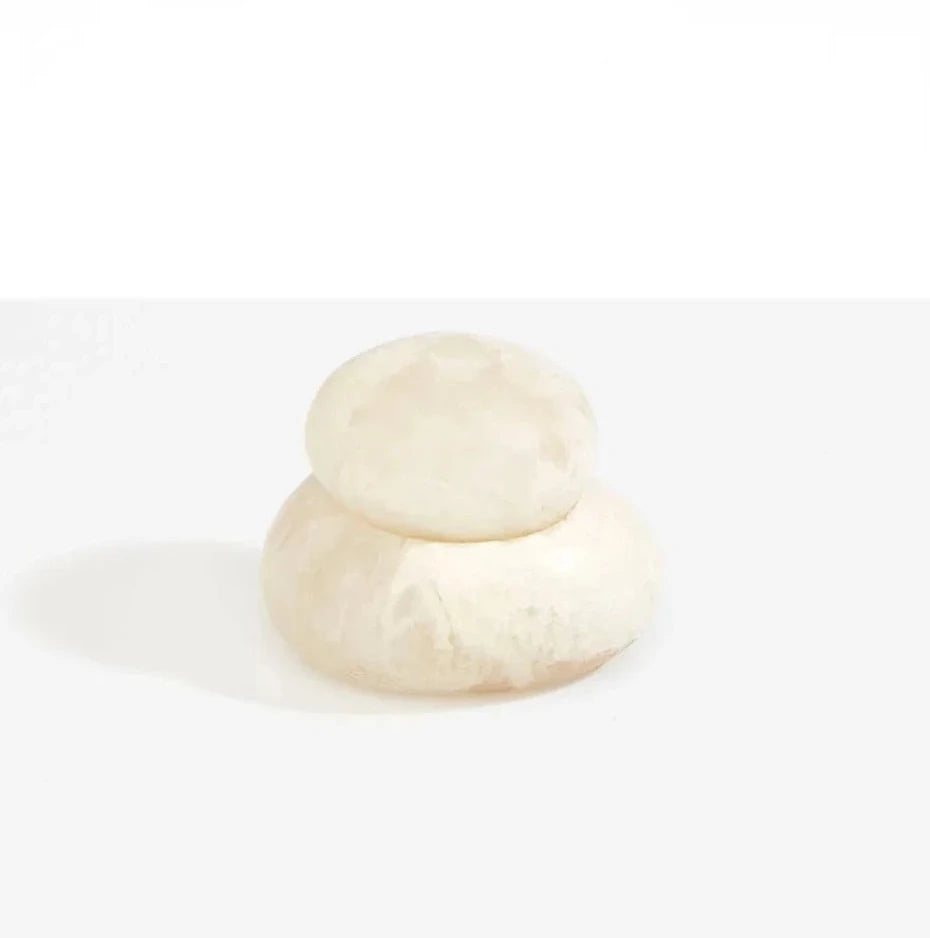 Dinosaur Designs Medium Pebble Jar in Chalk Swirl resin with stacked pebble shape.