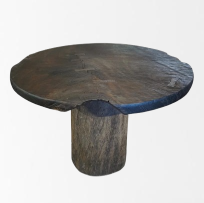 Round handcrafted Tallowwood dining table with single slab top and solid timber base.