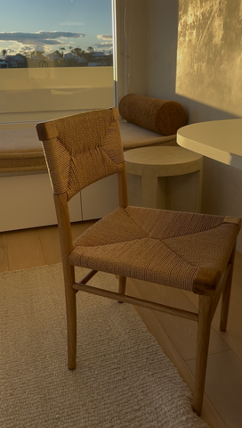 azul chair in natural oak displayed in a bedroom