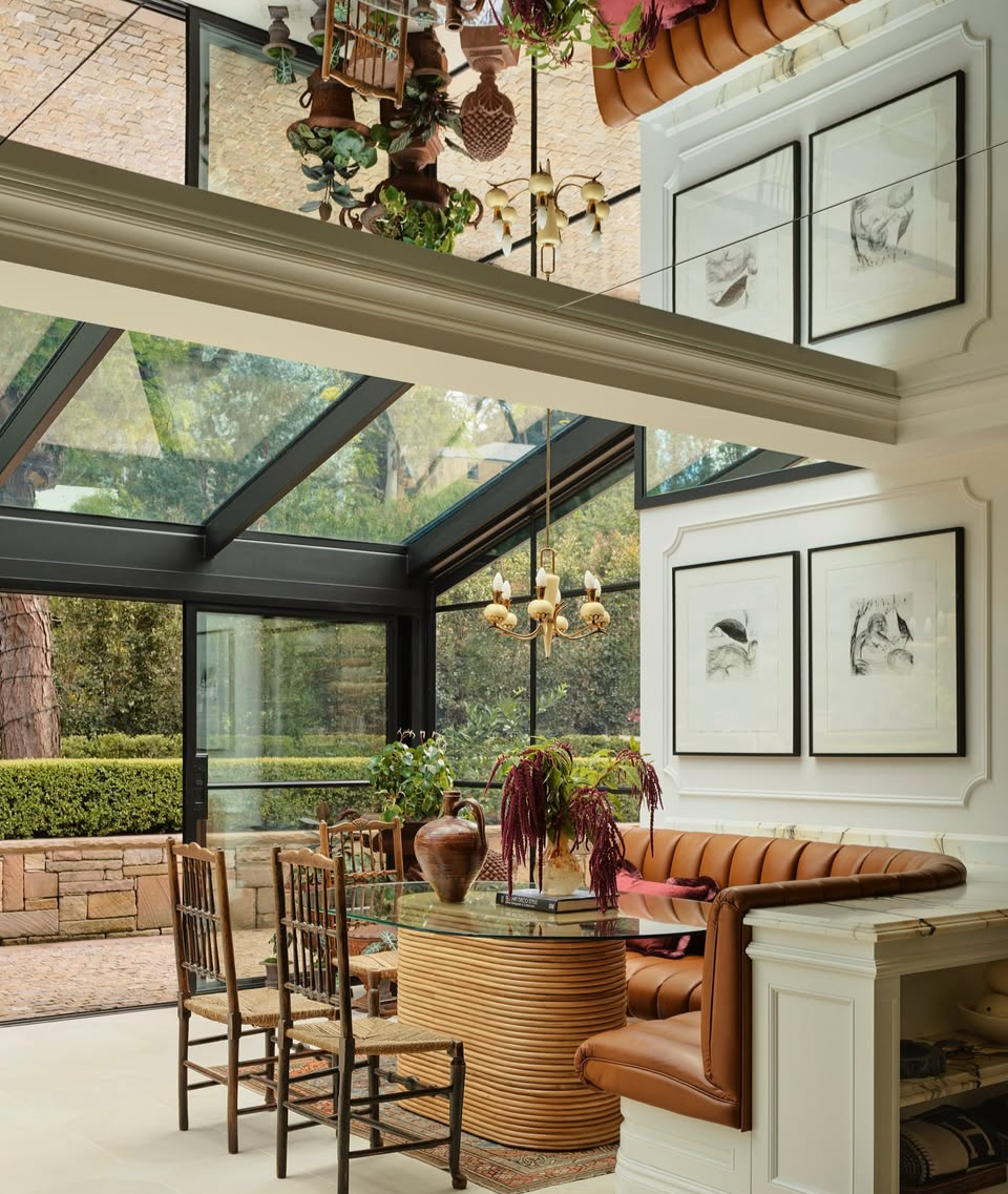 Interior design of a modern living room featuring our stylish Laguna glass dining table in rattan