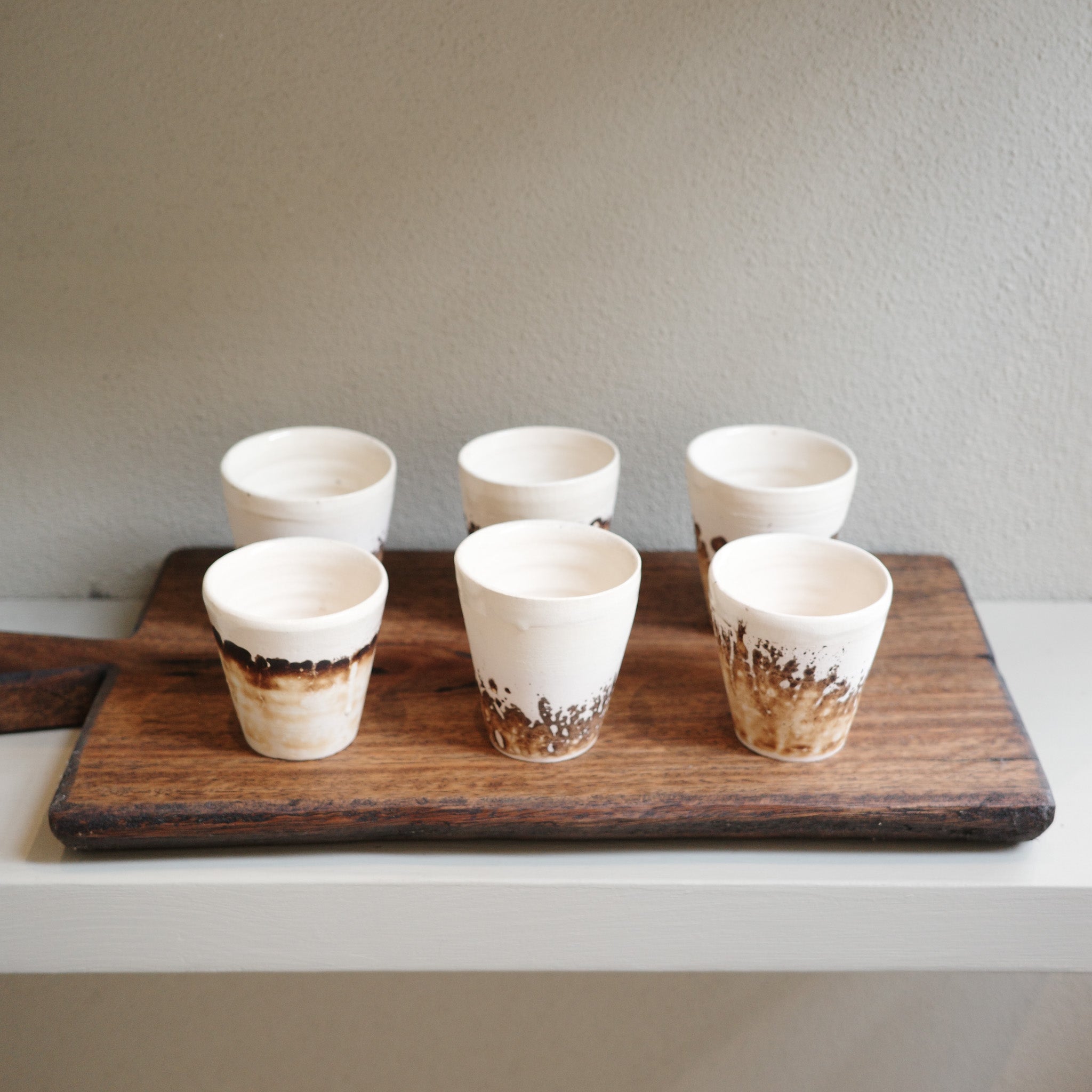 Handmade Obvara espresso cup with smoky glaze finish, unique ceramic by Mullumbimby artist Jacqui Sosnowski. Sold individually.