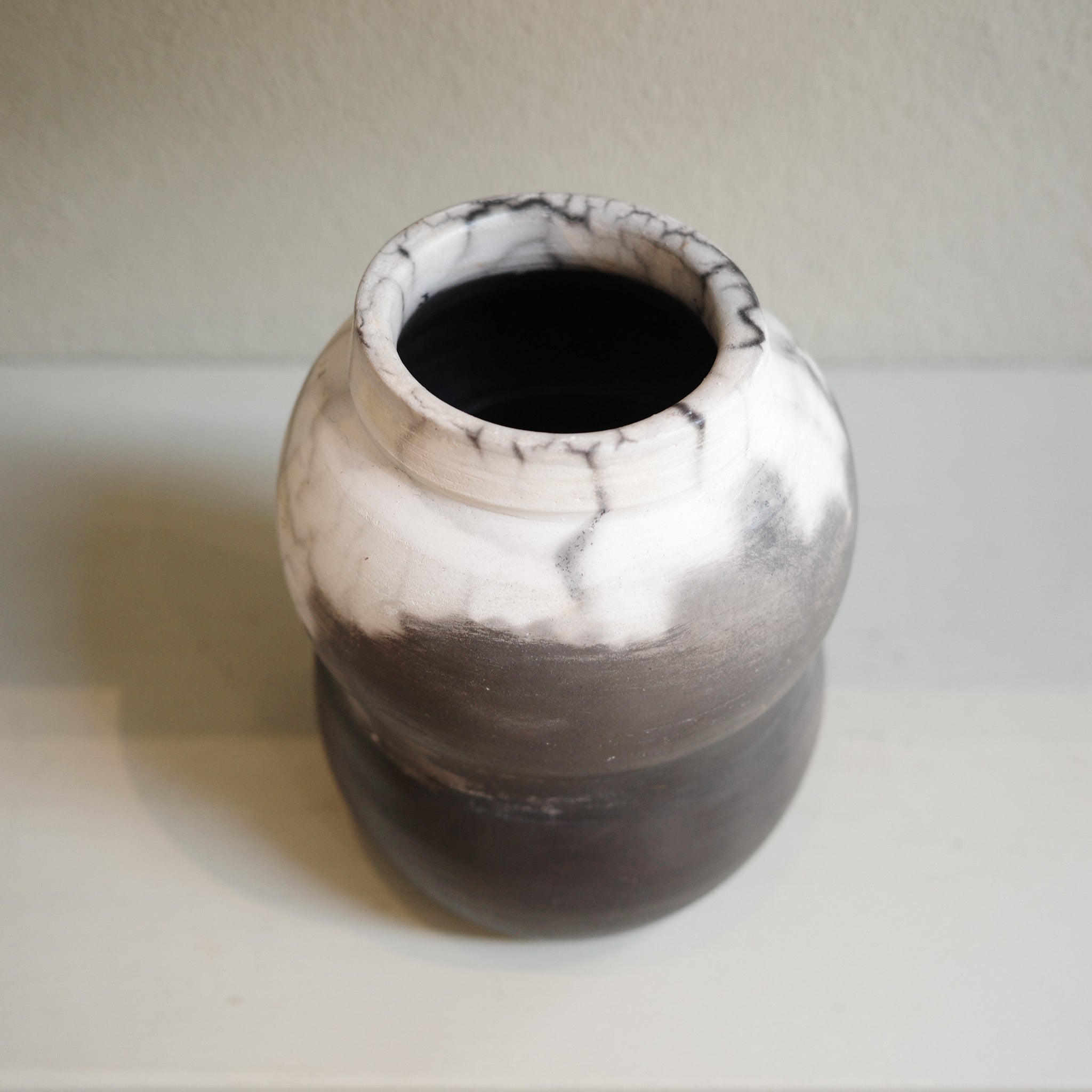 Naked raku ceramic vase with smoky monochrome finish, handmade by Australian artist Jacqui Sosnowski.