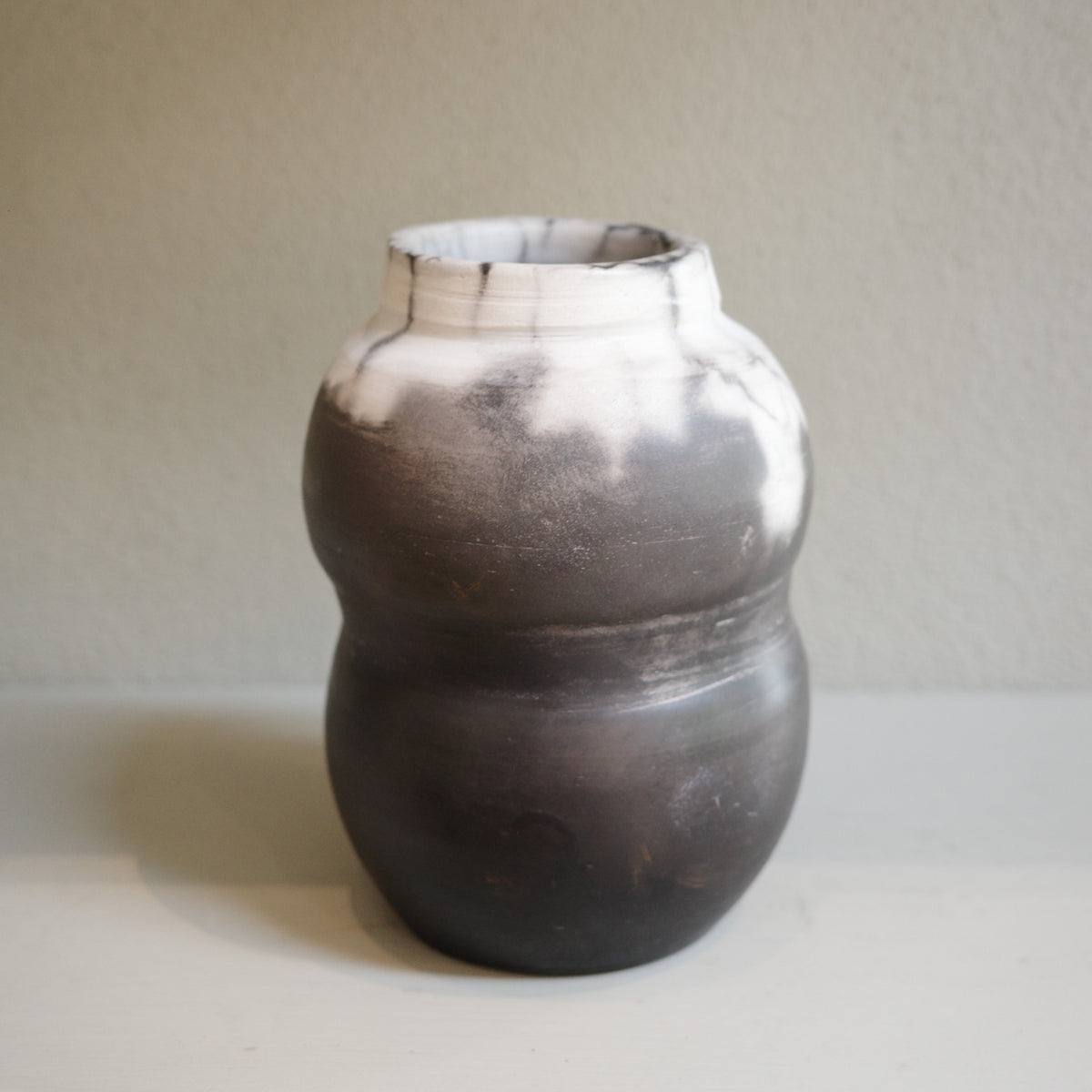 Naked raku ceramic vase with smoky monochrome finish, handmade by Australian artist Jacqui Sosnowski.