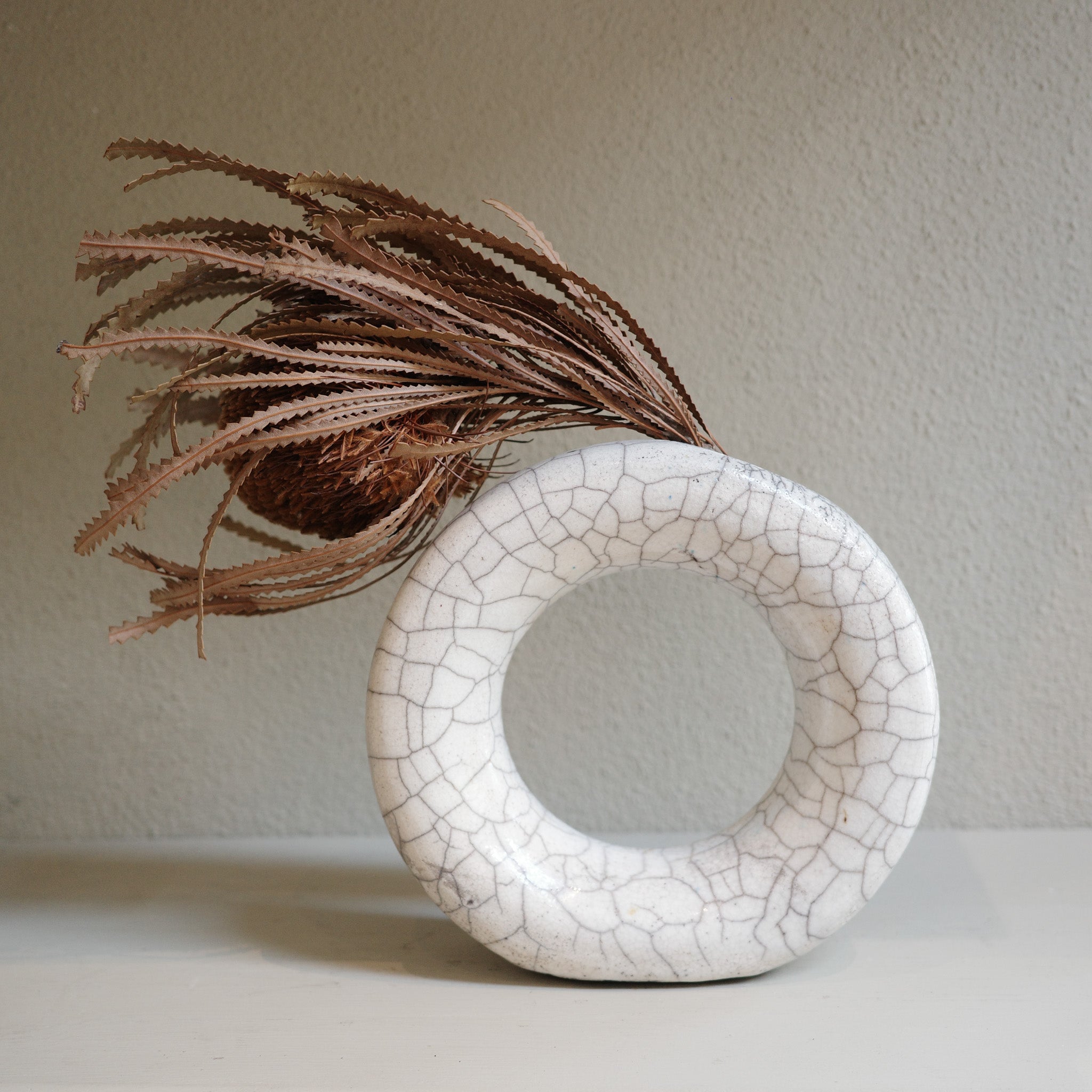 Unique handmade glazed Raku circle vase with crackled finish by Mullumbimby ceramicist Jacqui Sosnowski.