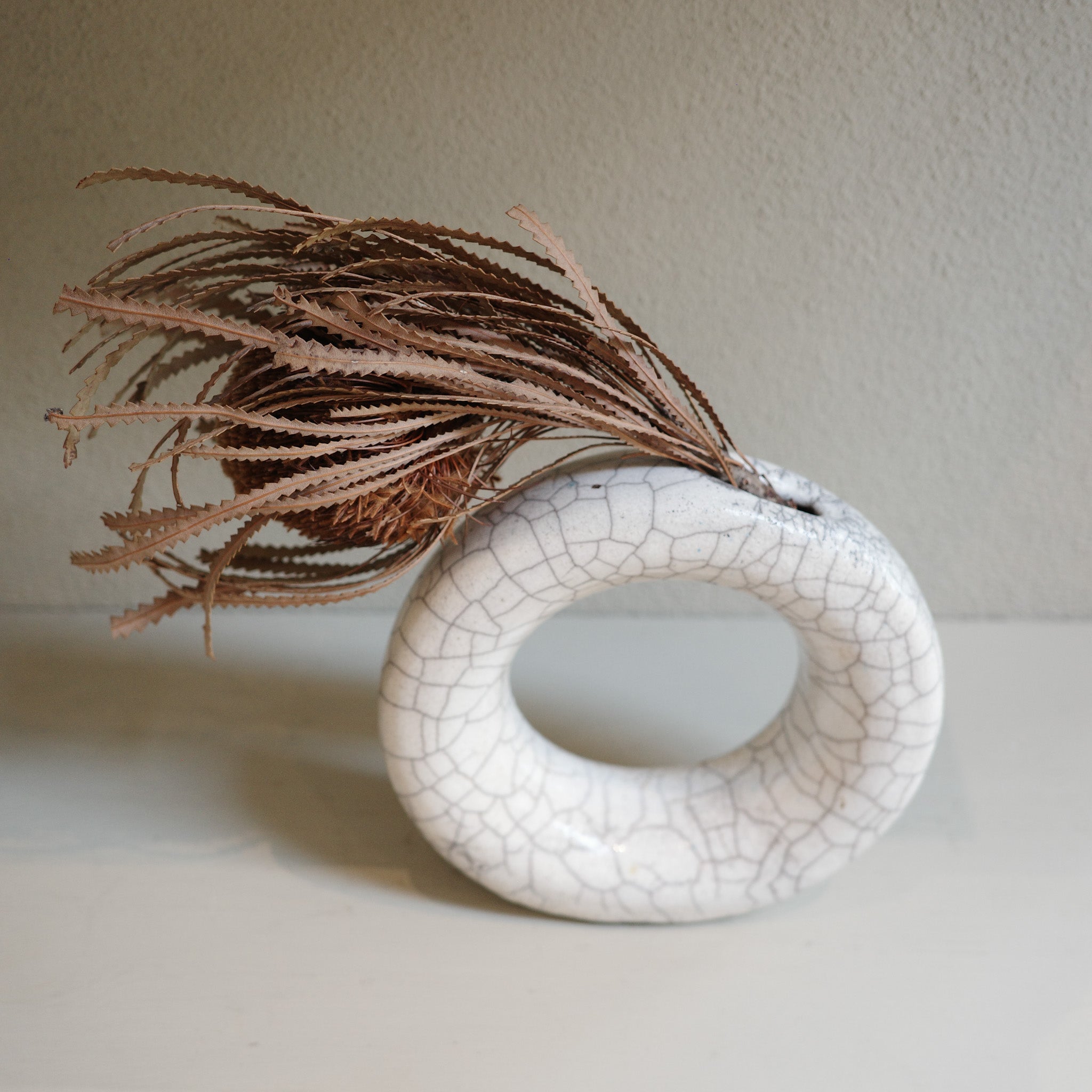 Round ceramic Raku vase with glazed crackle finish, artisan handmade in Australia.