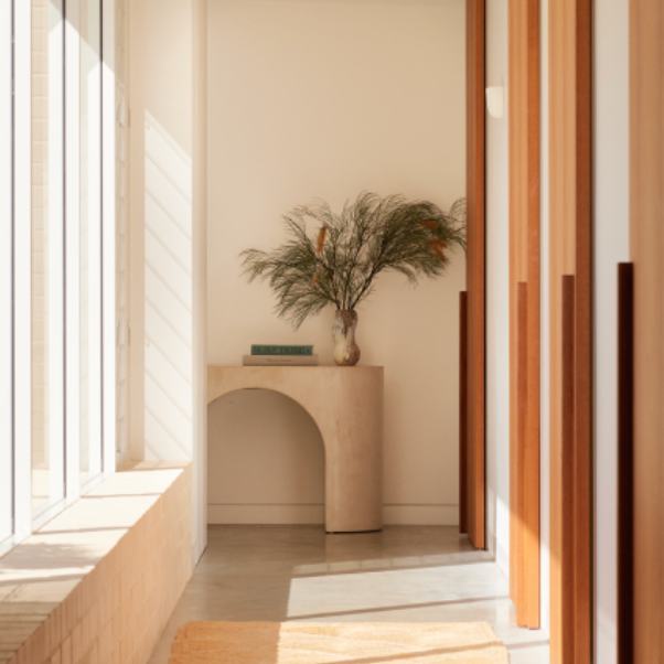 Nova Console in Oyster micro-cement styled in a hallway