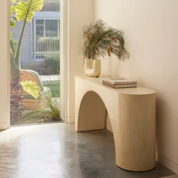 Nova console in Oyster micro-cement styled with books and vase 