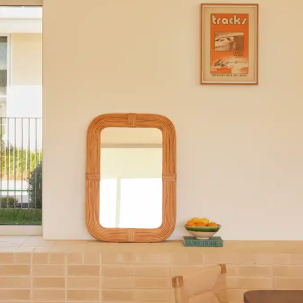 Dune Curved Vanity Rattan Mirror styled in a modern living room