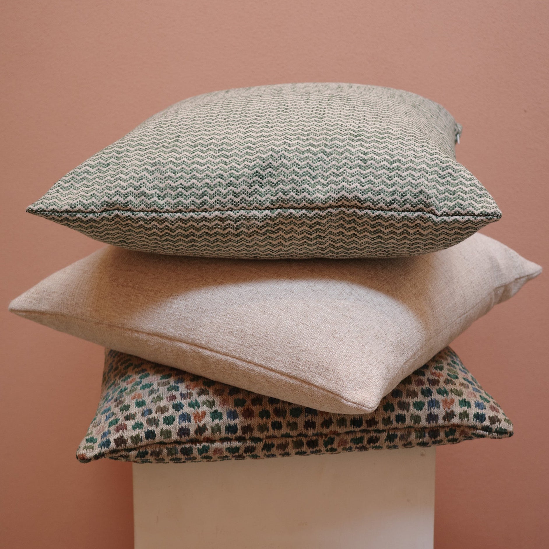 Stack of forest and neutral cushions – Bodhi Living