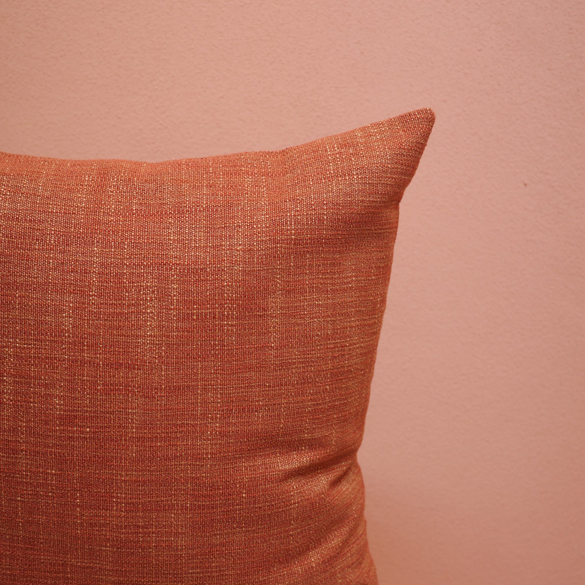 Close-up of textured Rust Cushion 55×55 cm in warm woven fabric – Bodhi Living