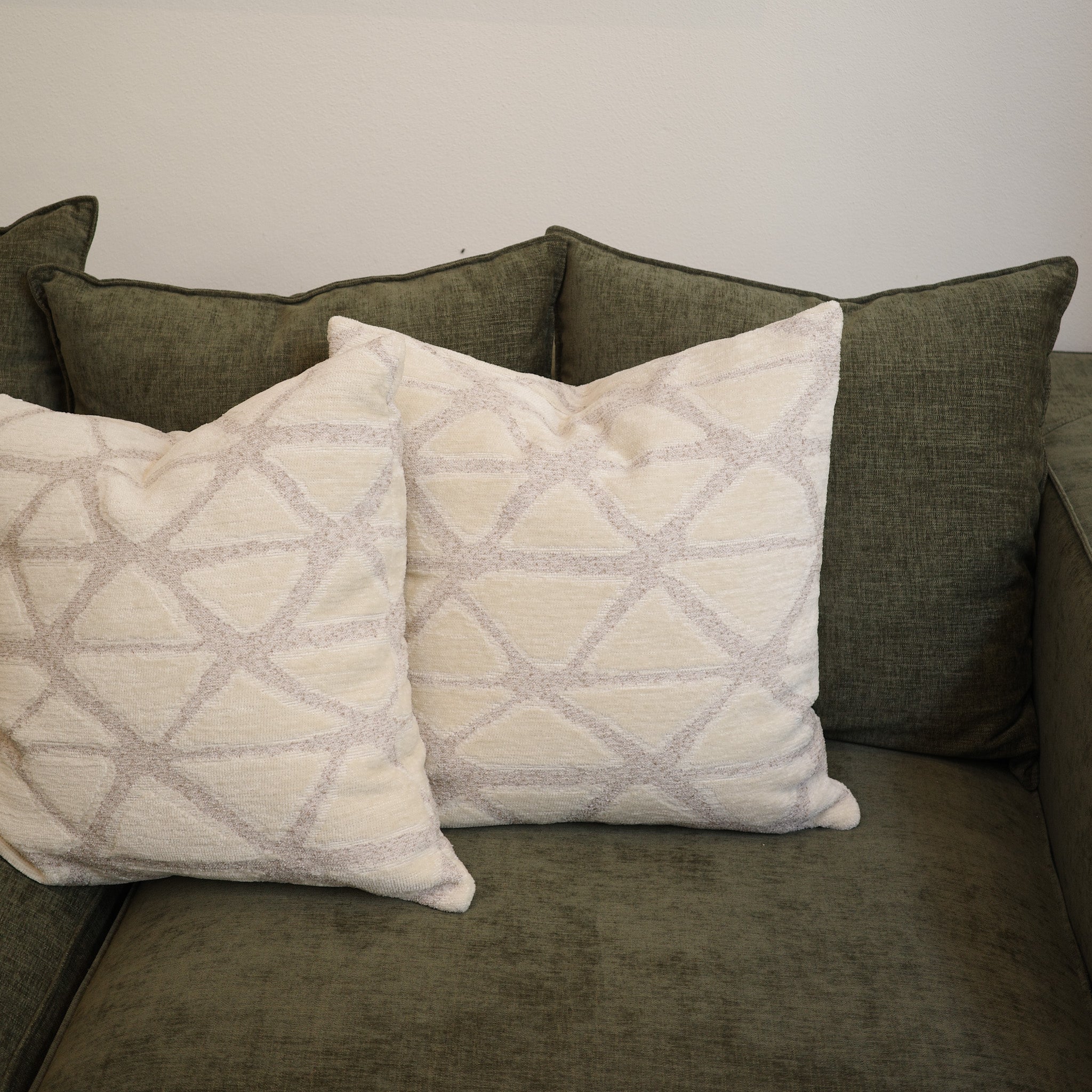 Premium textured cushions 55×55 cm styled on green sofa – Bodhi Living exclusive