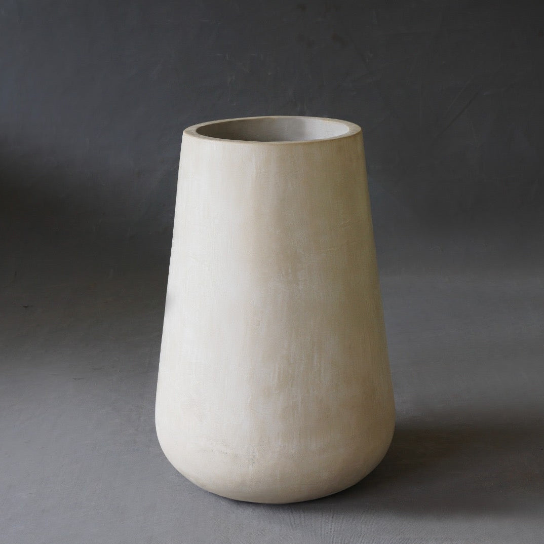 Alba Round Planter in Oyster finish, front view showing matte micro cement surface.