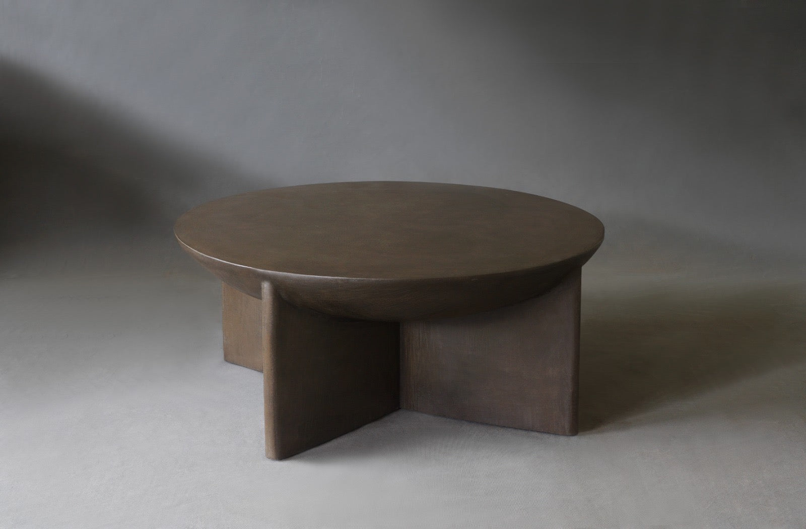 Axel Round Coffee Table in micro cement in Pebble finish