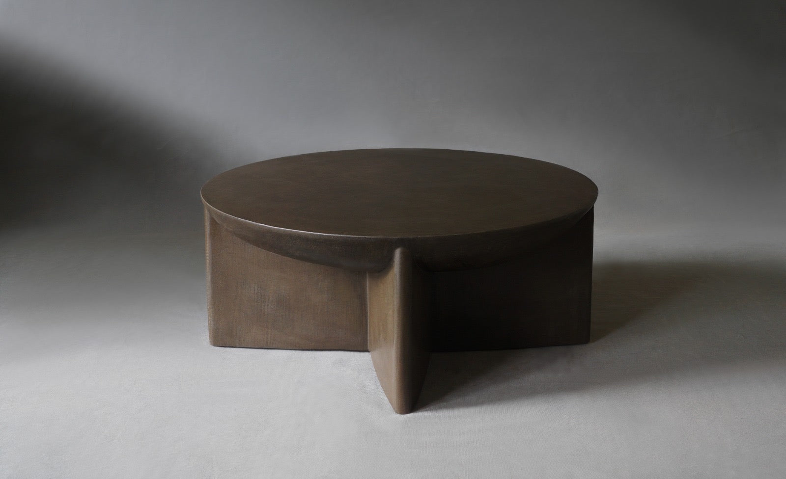 Axel Round Coffee Table in micro cement in Pebble finish