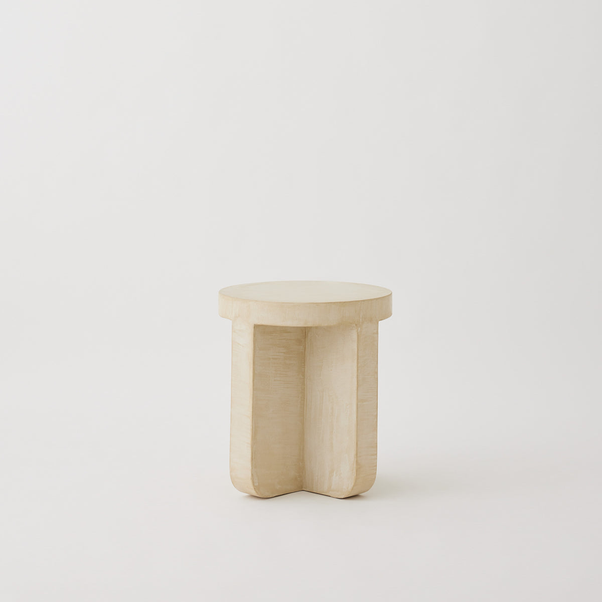 Axel side table micro-cement surface in Oyster showing hand-rendered texture