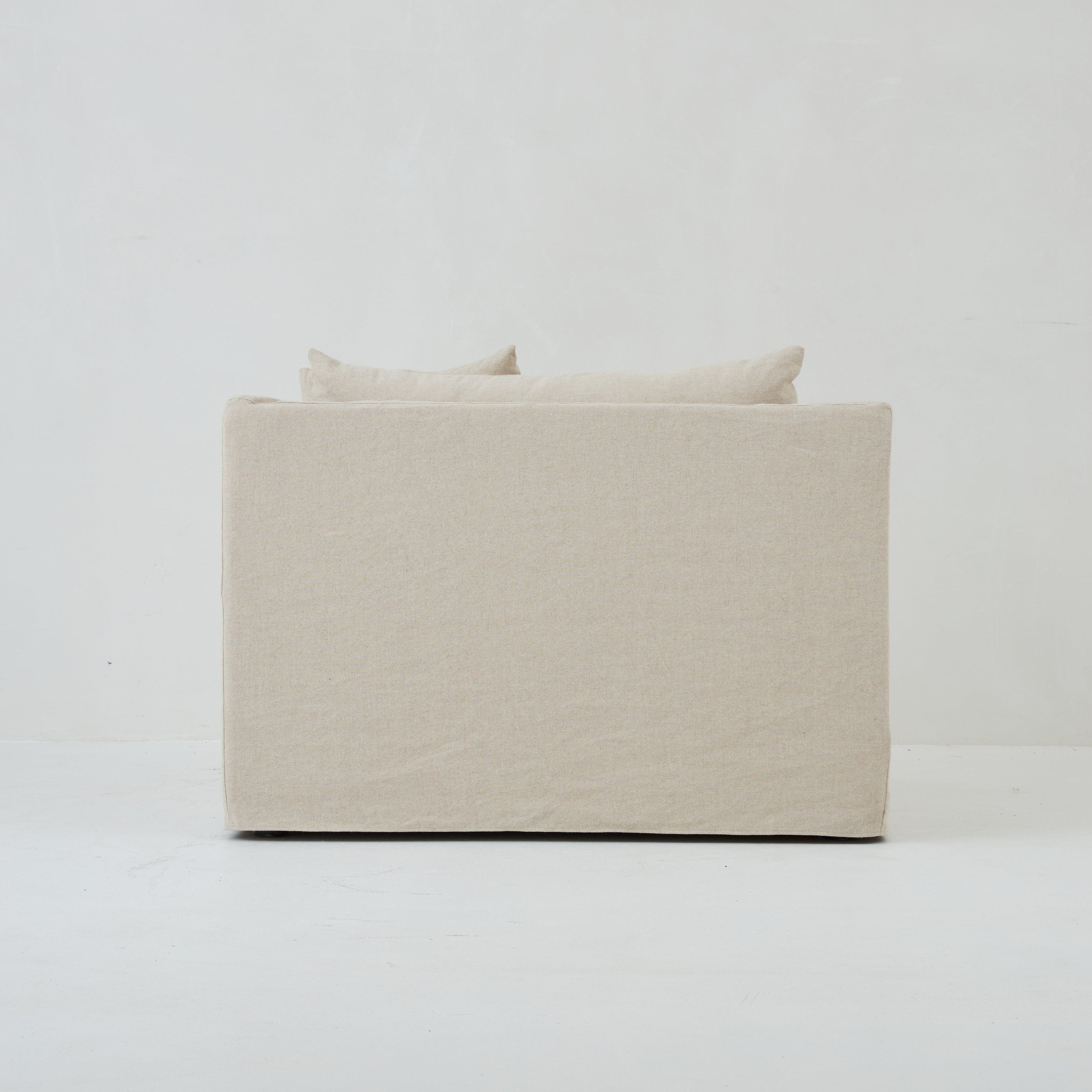 Back view of the Ayla Armchair in Beige Linen fabric loose linen cover