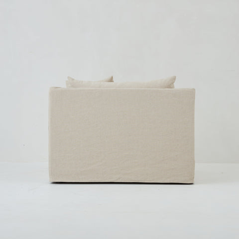 Back view of the Ayla Armchair in Beige Linen fabric loose linen cover