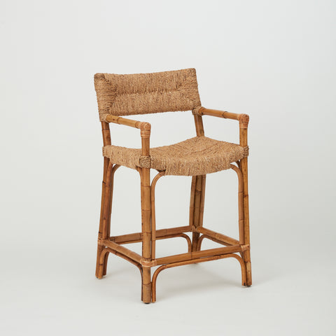Azul woven rope bar stool in natural rattan, three-quarter angle highlighting seat and backrest.
