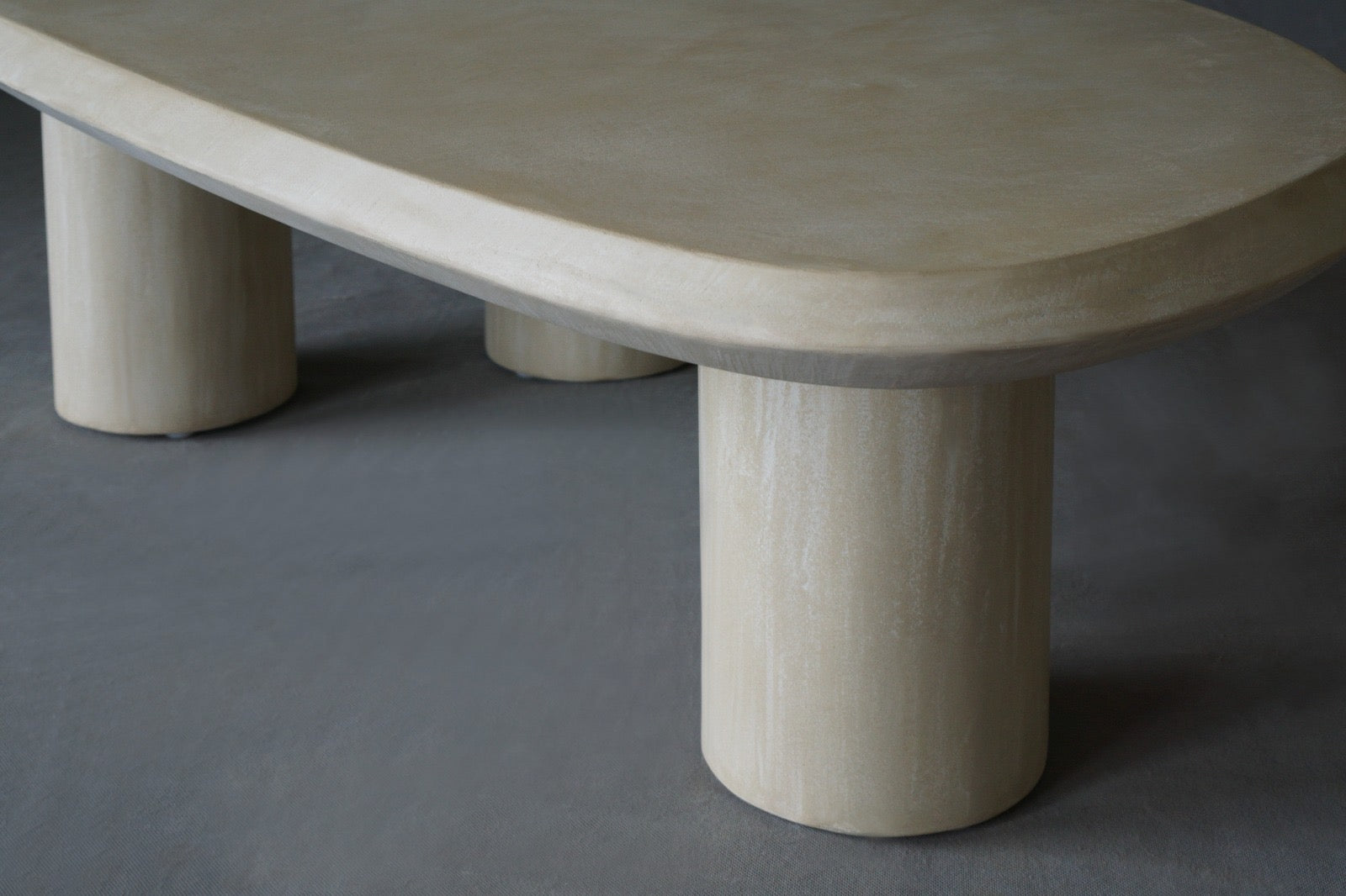 Close-up view of the Bean coffee table in Oyster finish 