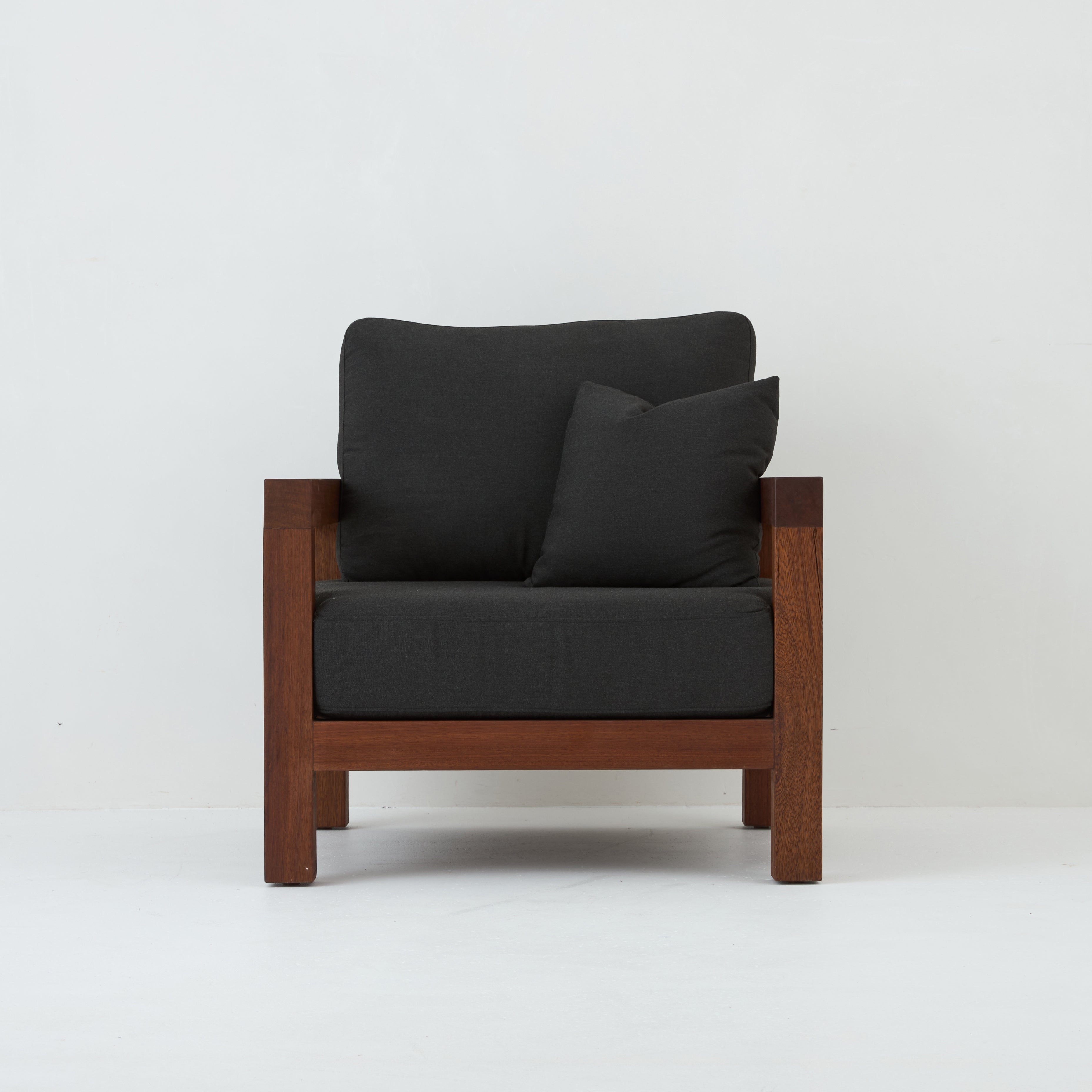 Front view of Cali teak armchair with coal cushions