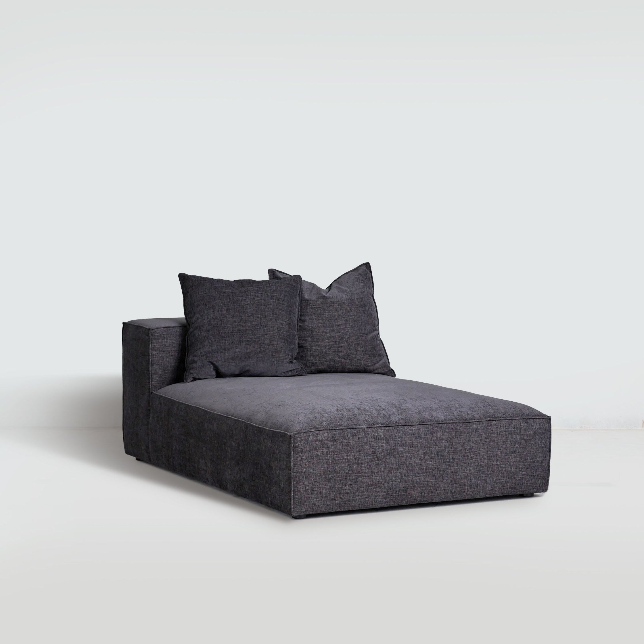 Cosmos Chaise upholstered in Charcoal, modular sofa lounger