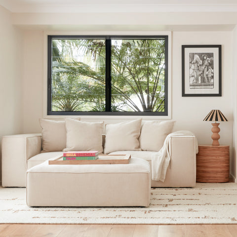 Cosmos Ottoman styled as a stand-alone coffee table in a Japandi-inspired interior with natural tones.