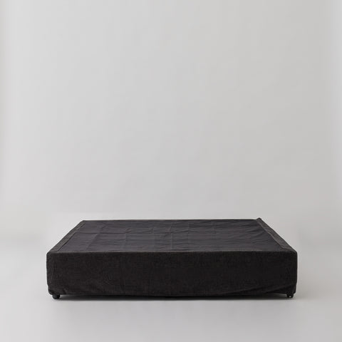 Cosmos Valance cover in Charcoal fabric, neatly fitted over a Queen bed base.