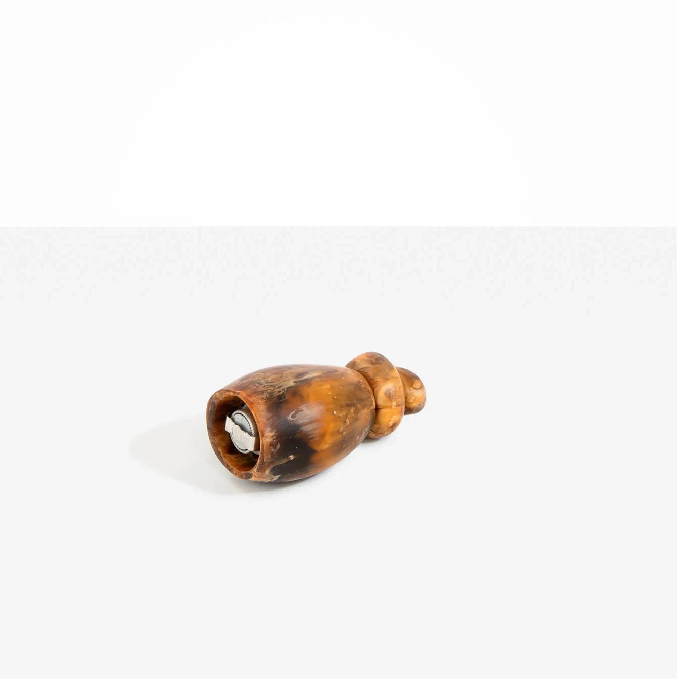 Dinosaur Designs Boulder Pepper Grinder in Dark Horn resin with sculptural pebble shape.