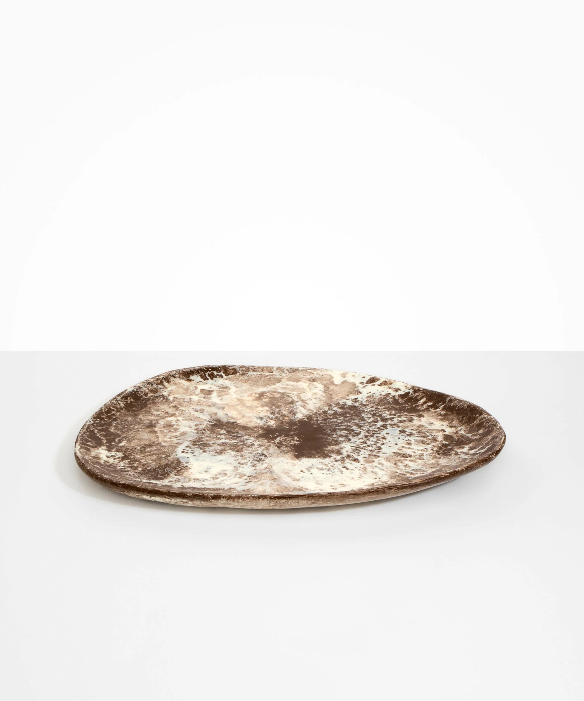 Dinosaur Designs Large Pebble Platter in Cappuccino resin with rich marbled swirls and organic form.