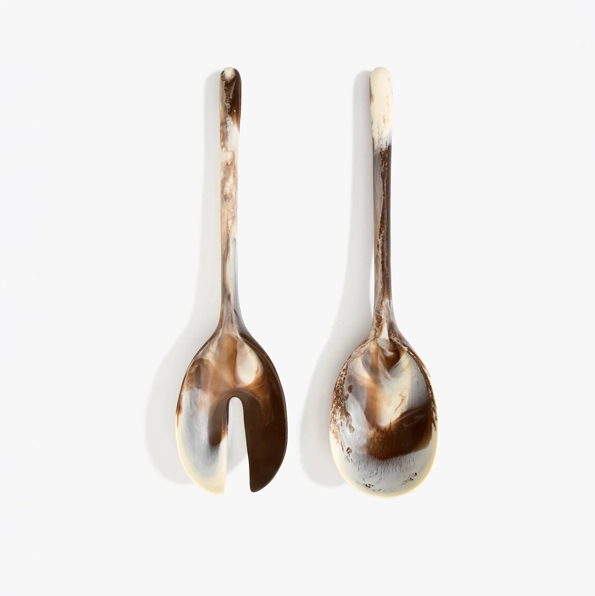 Dinosaur Designs Long Stone Servers in Cappuccino resin with sculptural spoon-like shape.