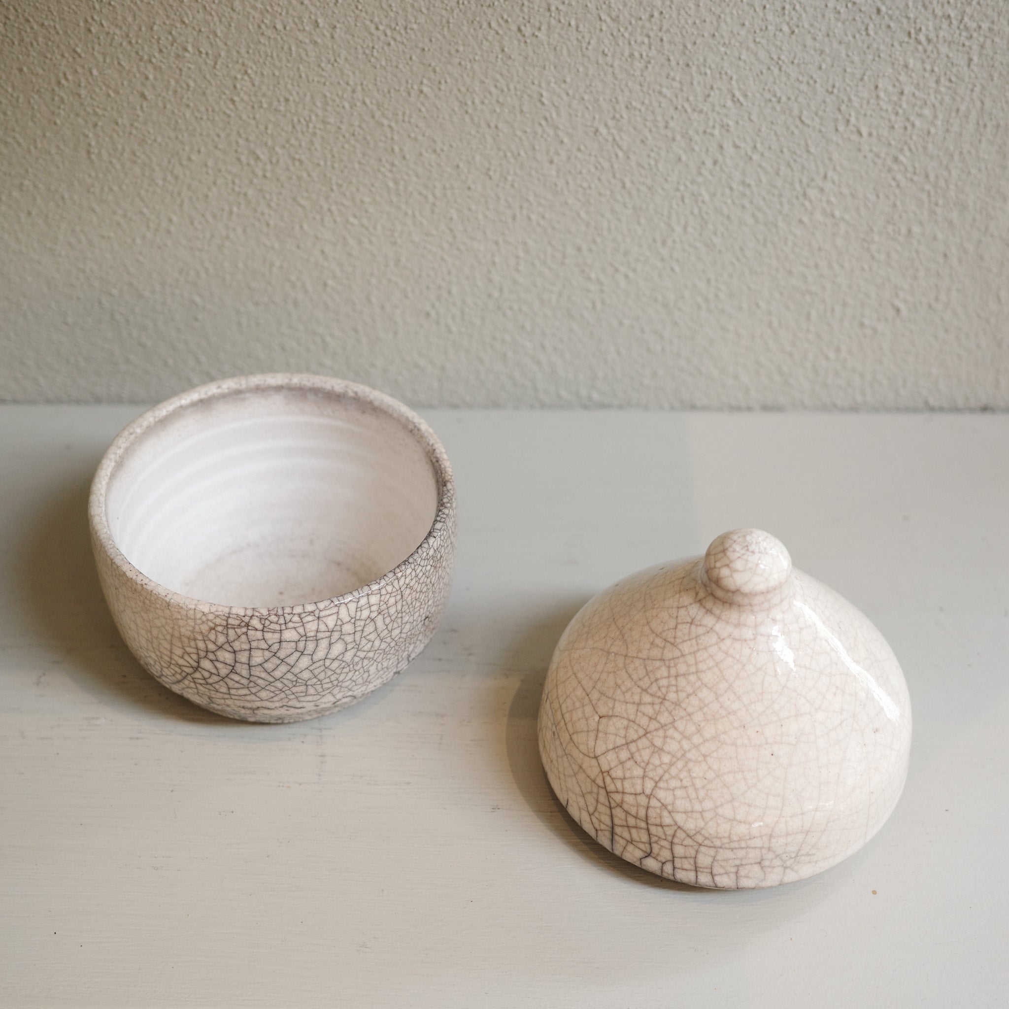 Handmade glazed Raku canister with domed lid and crackle finish by Mullumbimby artist Jacqui Sosnowski.
