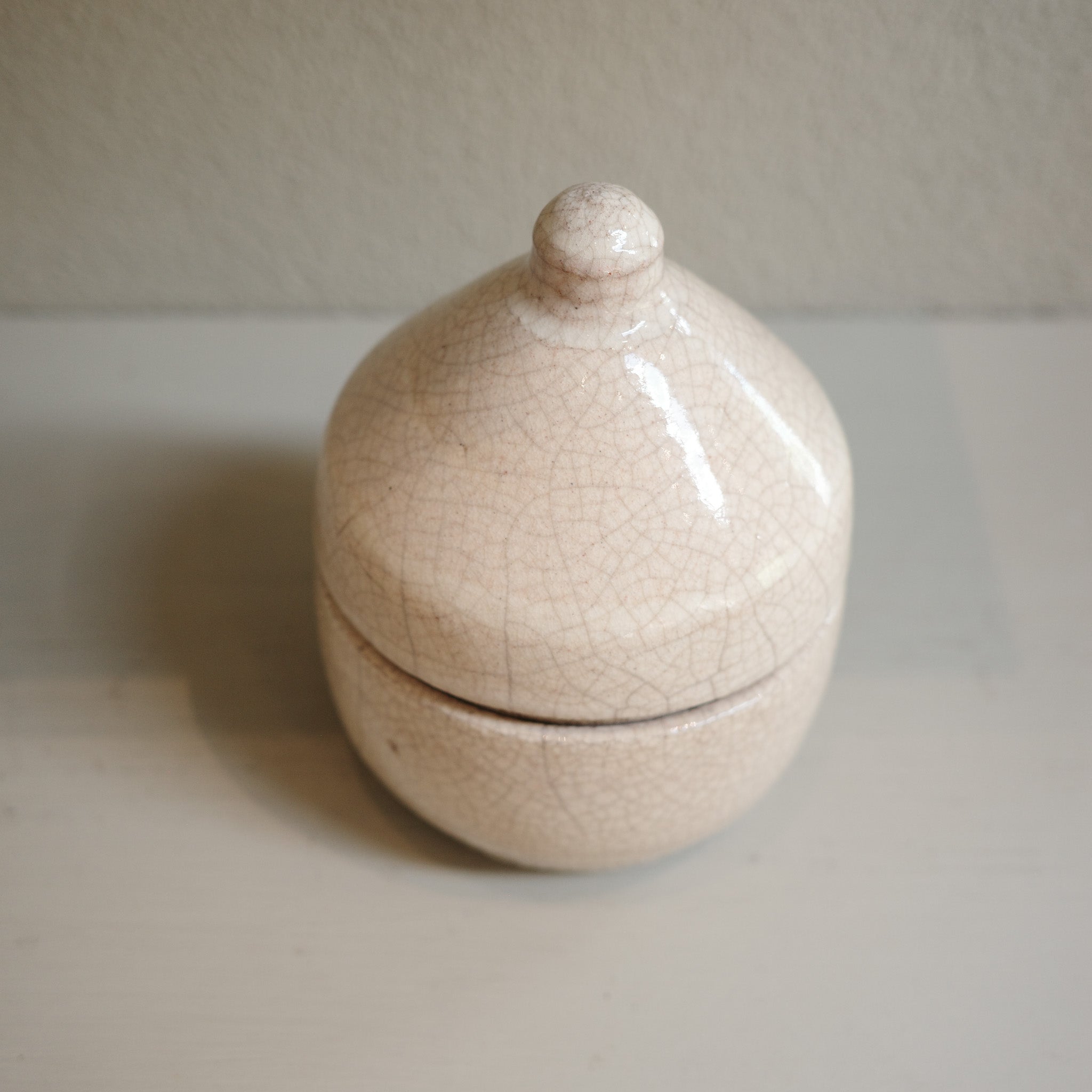 Handmade glazed Raku canister with domed lid and crackle finish by Mullumbimby artist Jacqui Sosnowski.