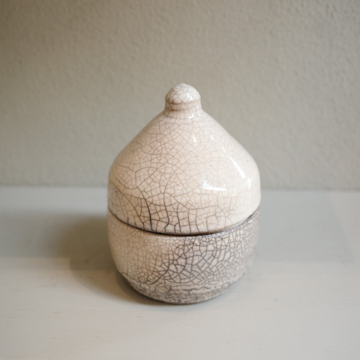 Handmade glazed Raku canister with domed lid and crackle finish by Mullumbimby artist Jacqui Sosnowski.