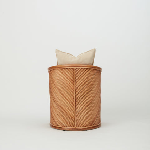 Close-up of Grace dining chair showing diagonal rattan weaving and warm natural finish.
