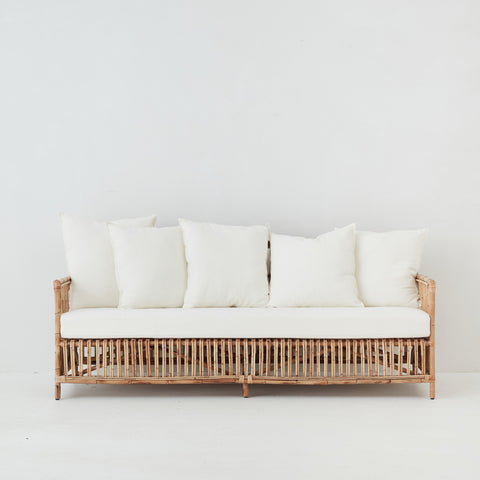 Lene Rattan Sofa with cream cushions – front view