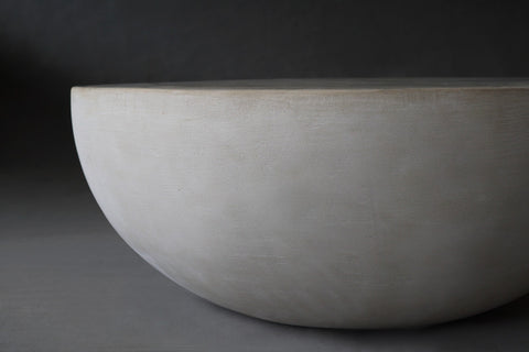 Close-up view of the Moon Coffee Table in 900 Diameter in Oyster finish