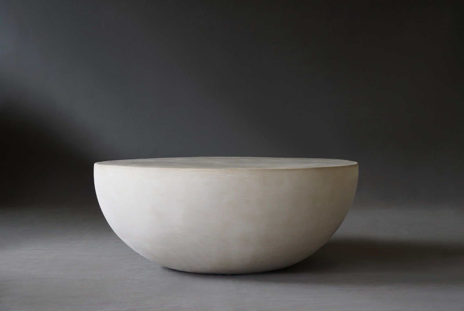 Front view of the Moon Coffee Table in 900 Diameter in Oyster finish
