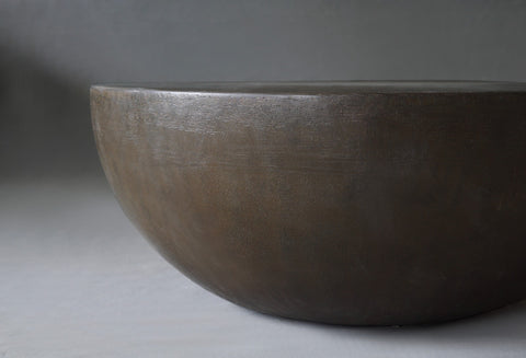 Close-up view of the Moon Coffee Table in 900 Diameter in Pebble finish