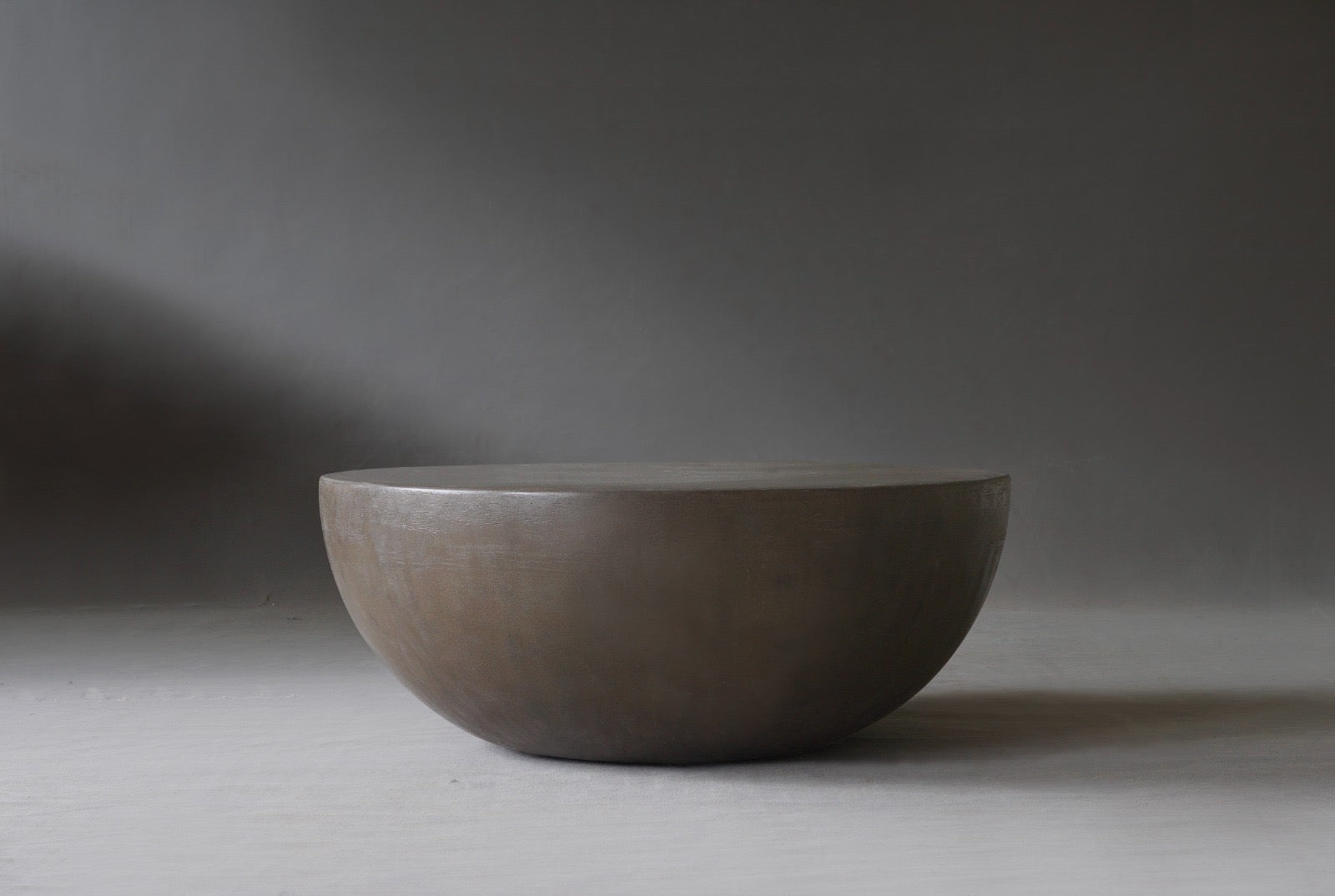 Front view of the Moon Coffee Table in 900 Diameter in Pebble finish 