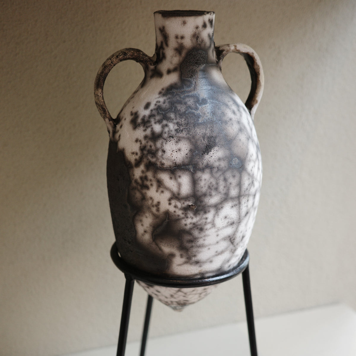 Handmade Naked Raku Amphora Vase with twin handles on black metal stand – Jacqui Sosnowski ceramic